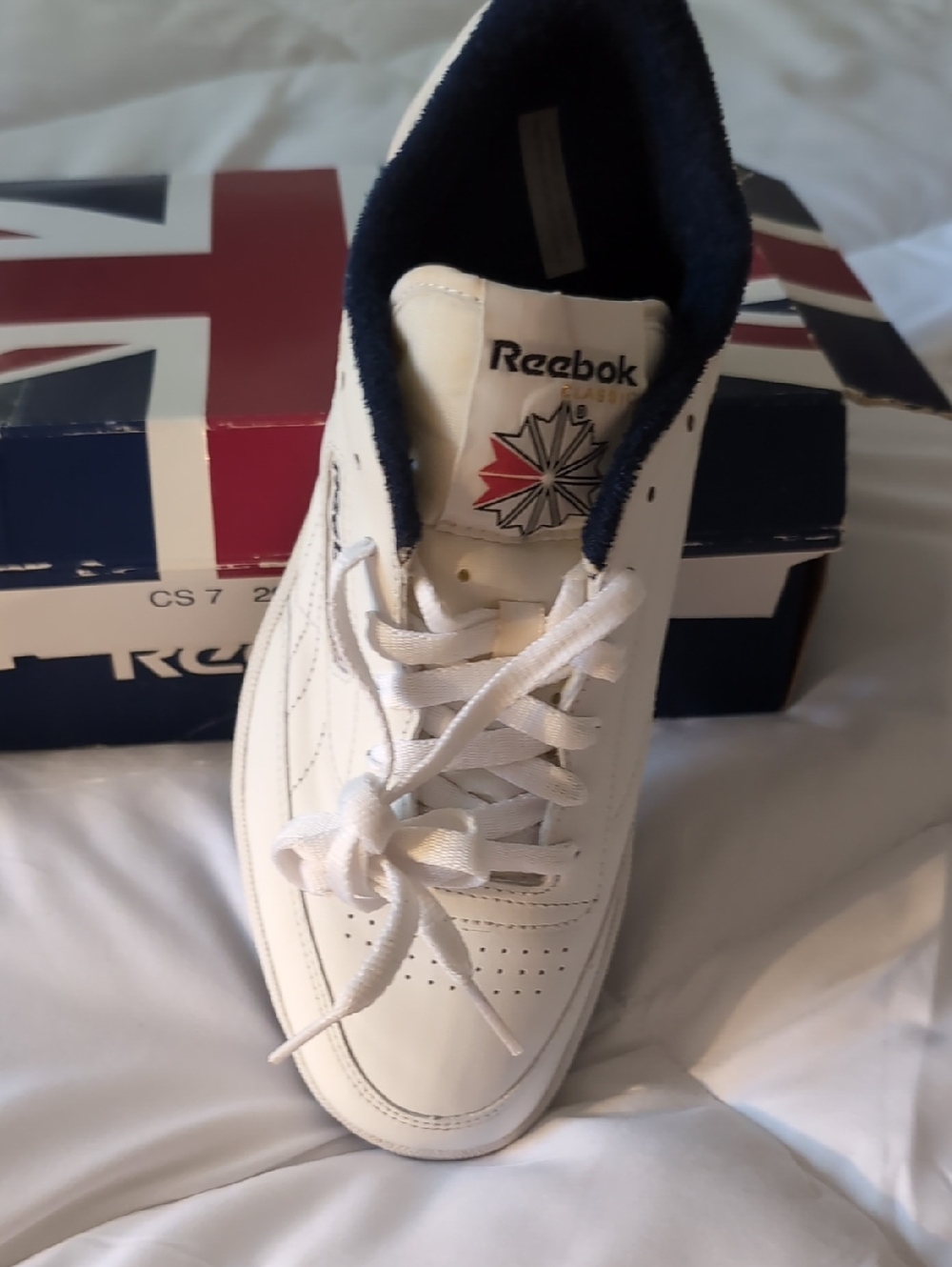 Reebok White Leather Sneaker with Navy Collar and Red Accent